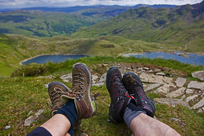 2 people's walking boots on a break on snowdonia