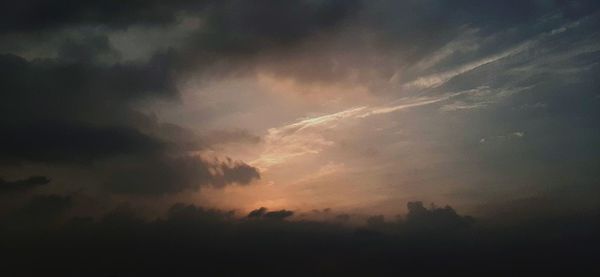 Low angle view of dramatic sky during sunset