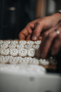 Cropped hand of person preparing food