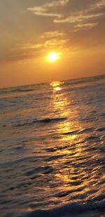 Scenic view of sea against romantic sky at sunset