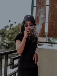 Young man smoking cigarette