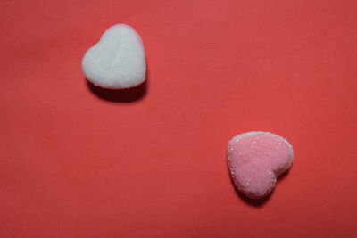 Close-up of heart shape on red table