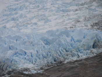 High angle view of glacier on sea shore
