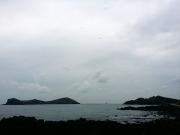 View of calm beach against the sky