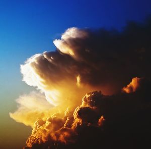 Low angle view of cloudy sky at sunset