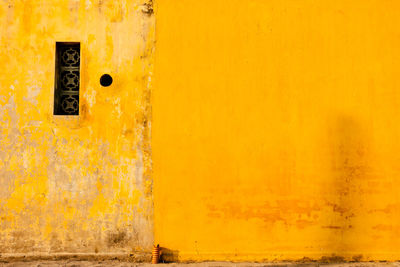 Full frame shot of old yellow wall
