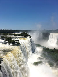 Scenic view of waterfall against clear sky