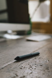 Close-up of pen on table
