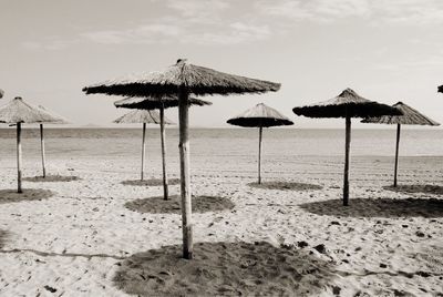 Lifeguard hut on beach against sky