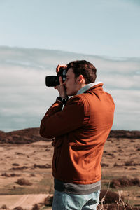 Man photographing with camera