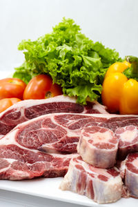 Close-up of vegetables and meat on table