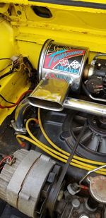 Close-up of yellow car on metal