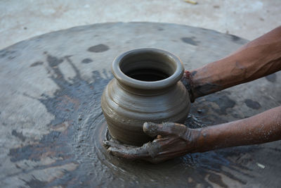 High angle view of person working in mud