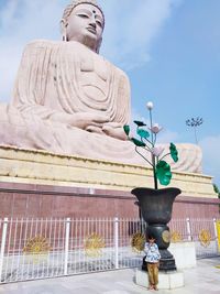 Low angle view of statue against building