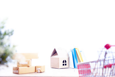 Close-up of toy on table against white background