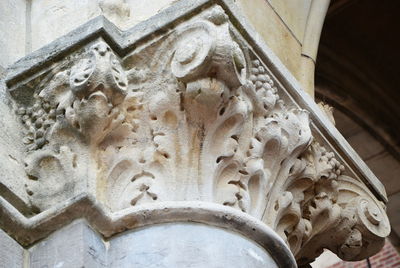 Low angle view of carving on ceiling