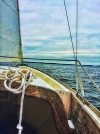 Close-up of rope in sea against sky