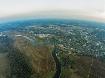 Aerial view of lake amidst landscape against sky