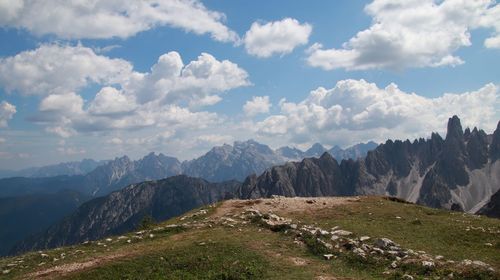 Scenic view of mountains against cloudy sky