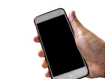 Close-up of hand holding smart phone over white background