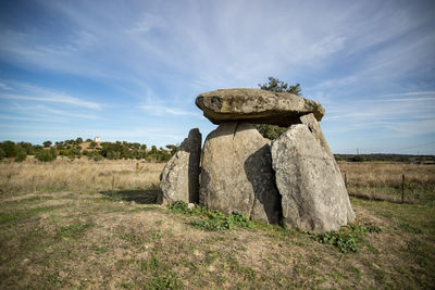 Low angle view of rock against sky