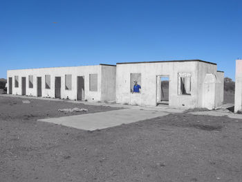Low angle view of historical building against clear blue sky