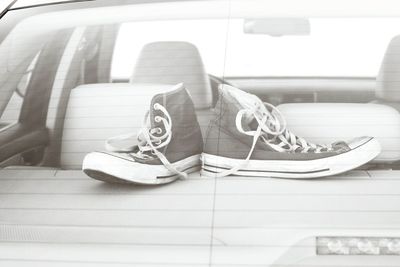 Shoes seen through windshield
