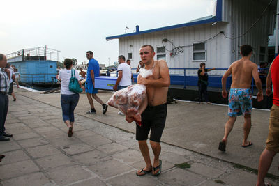 People on street against sky