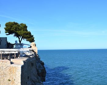 Scenic view of sea against blue sky