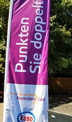 Close-up of information sign against trees