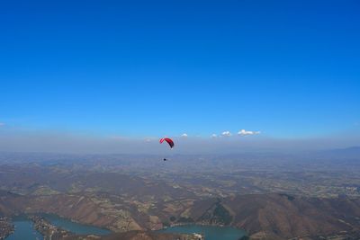 Scenic view of mountains against blue sky