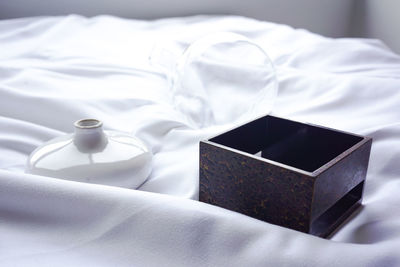 High angle view of coffee on bed