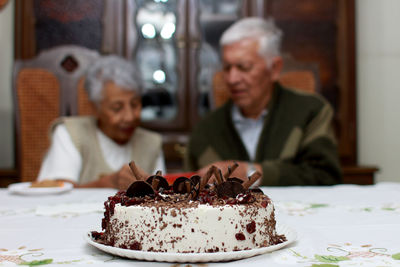 Close-up of cake with ice cream on table