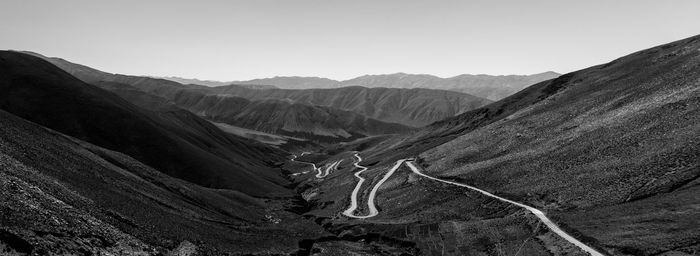 Scenic view of a mountain road against clear sky