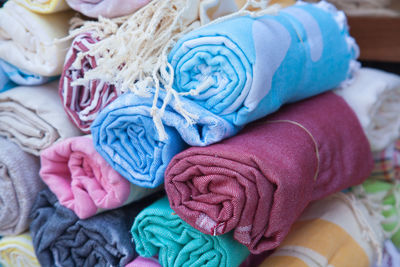 Close-up of rolled up textile for sale in market