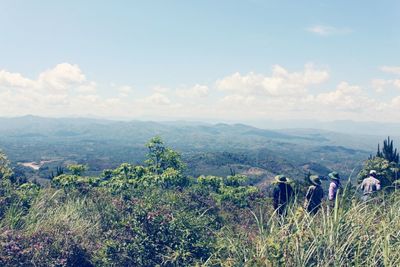 Scenic view of landscape against cloudy sky