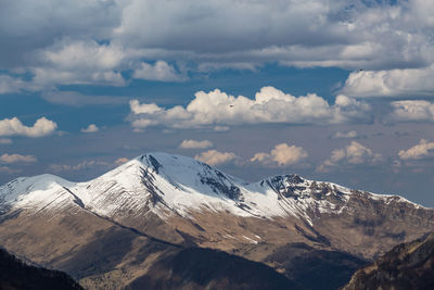 Mountain peaks covered with snow. scenic view of snowcapped mountains against sky