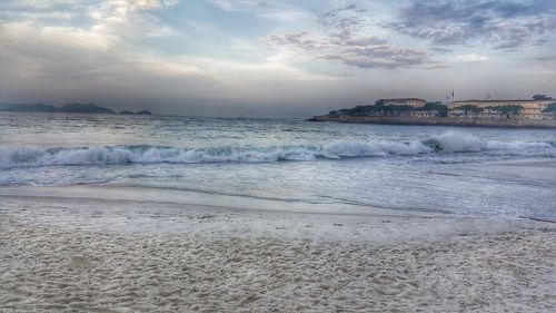 Scenic view of sea against cloudy sky