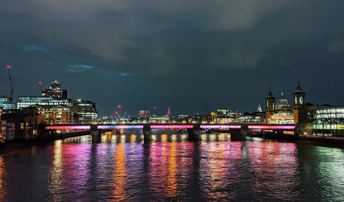 Illuminated buildings at waterfront