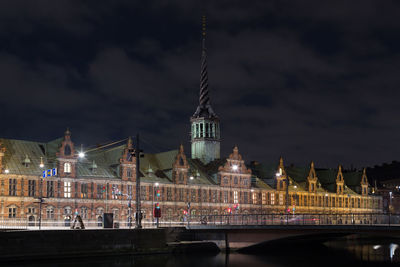 Illuminated buildings in city at night