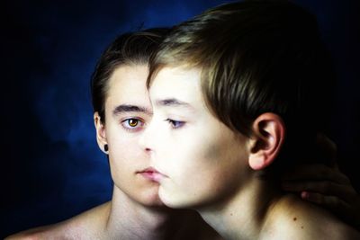 Close-up portrait of shirtless boy