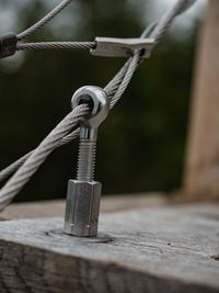 Stainless steel turn buckle and steel wire cable rope connection in detail view