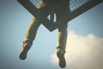 Low angle view of people against sky