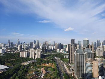 High angle view of modern buildings in city against sky