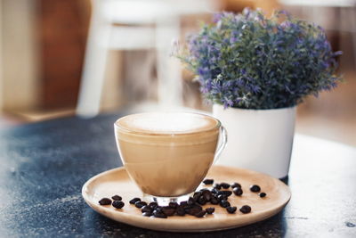 Close-up of coffee served on table