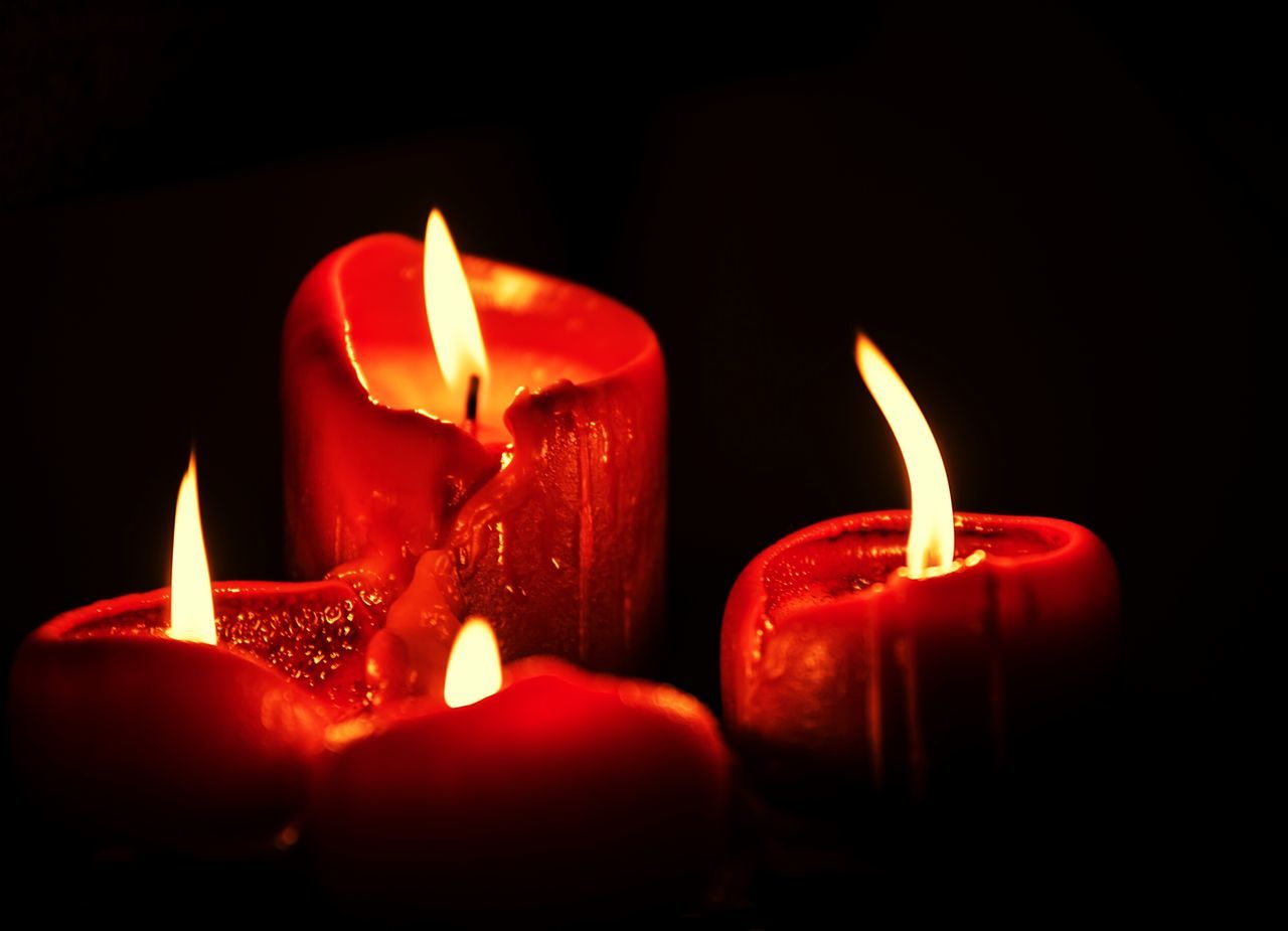 flame, burning, candle, black background, studio shot, fire - natural phenomenon, heat - temperature, illuminated, person, indoors, close-up, copy space, red, lit, glowing, dark, night, candlelight, fire, orange color