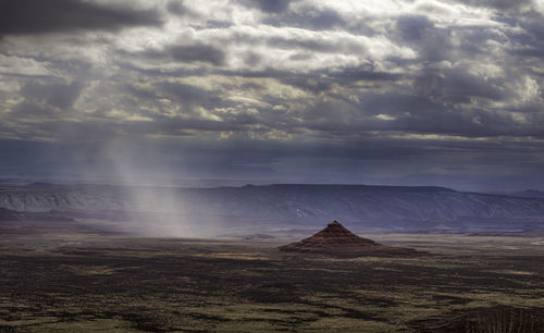 Scenic view of landscape against cloudy sky