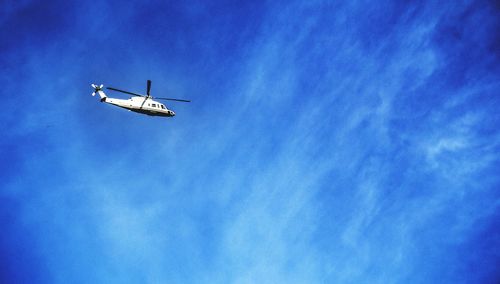 Low angle view of airplane against sky