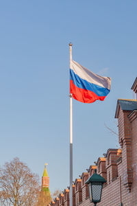 Russian flag on the background of the kremlin