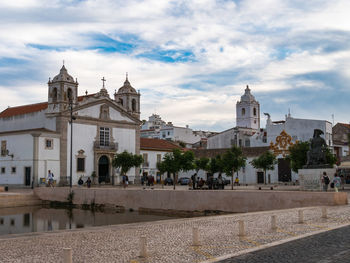 View of buildings in city against sky